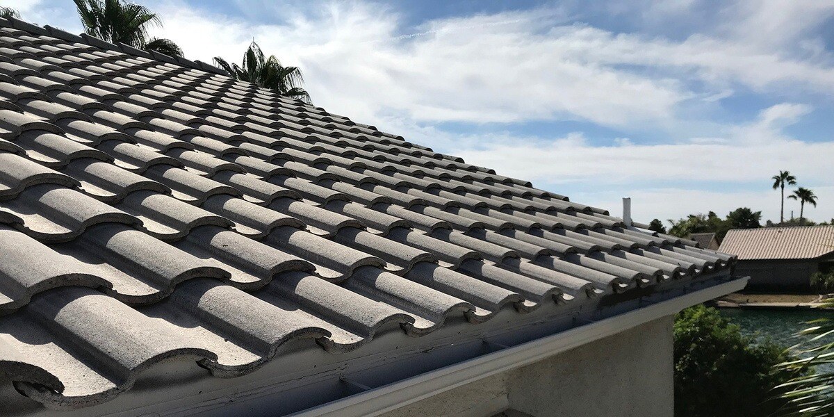 gray tiles roof and blue skies1200x600